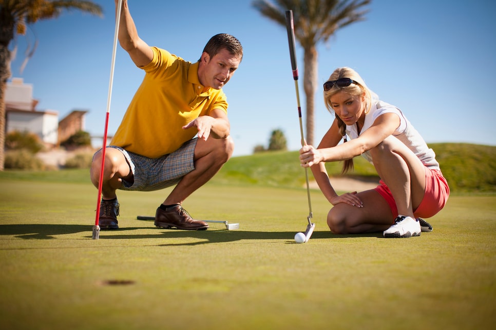 Couple playing golf