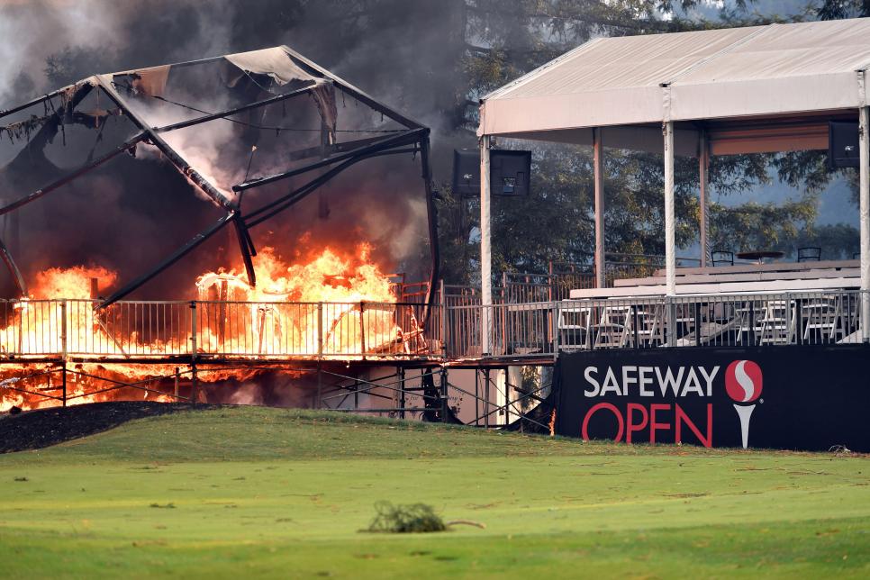A tent structure built for the 2017 Safeway Open burns on a golf course at the Silverado Resort and Spa in Napa, California on October 9, 2017, as multiple wind-driven fires continue to whip through the region.  / AFP PHOTO / JOSH EDELSON        (Photo credit should read JOSH EDELSON/AFP/Getty Images)