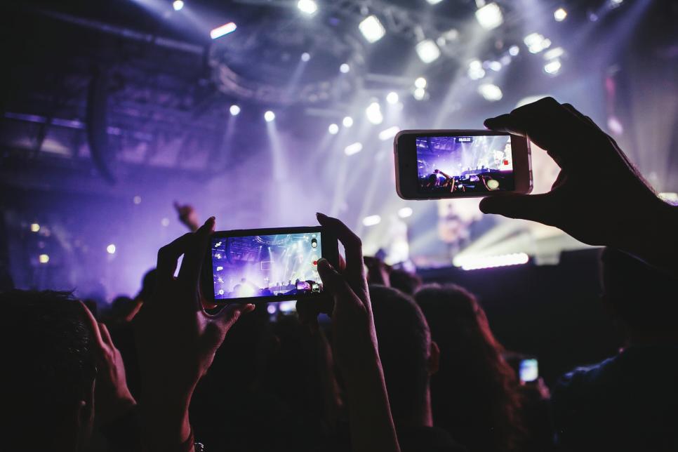 Fans Holding Smart Phones At Musical Concert