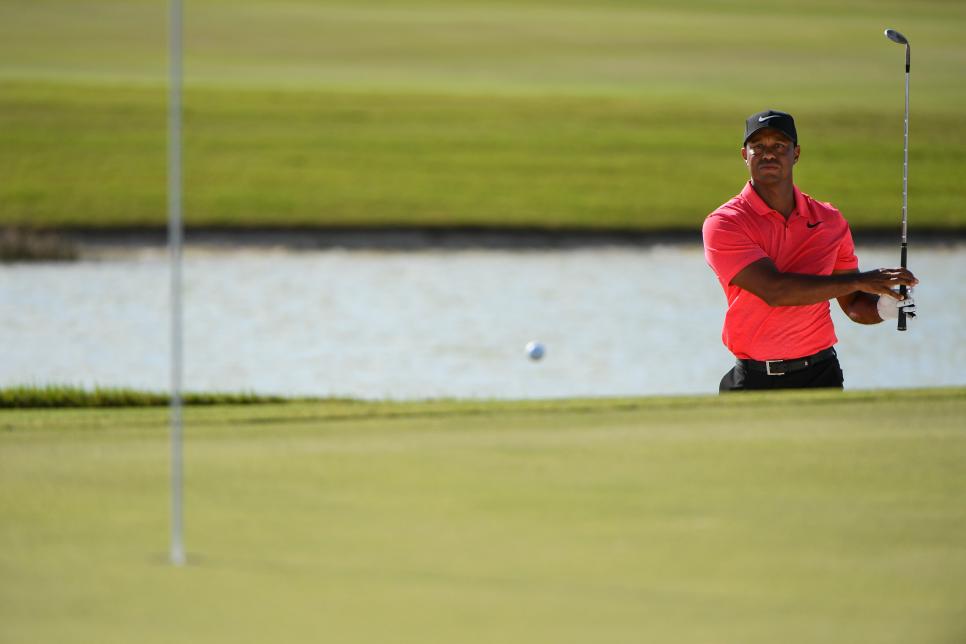 NASSAU, BAHAMAS - DECEMBER 03: Tiger Woods plays a bunker shot on the 17th hole during the final round of the Hero World Challenge at Albany course on December 3, 2017 in Nassau, Bahamas. (Photo by Ryan Young/PGA TOUR)