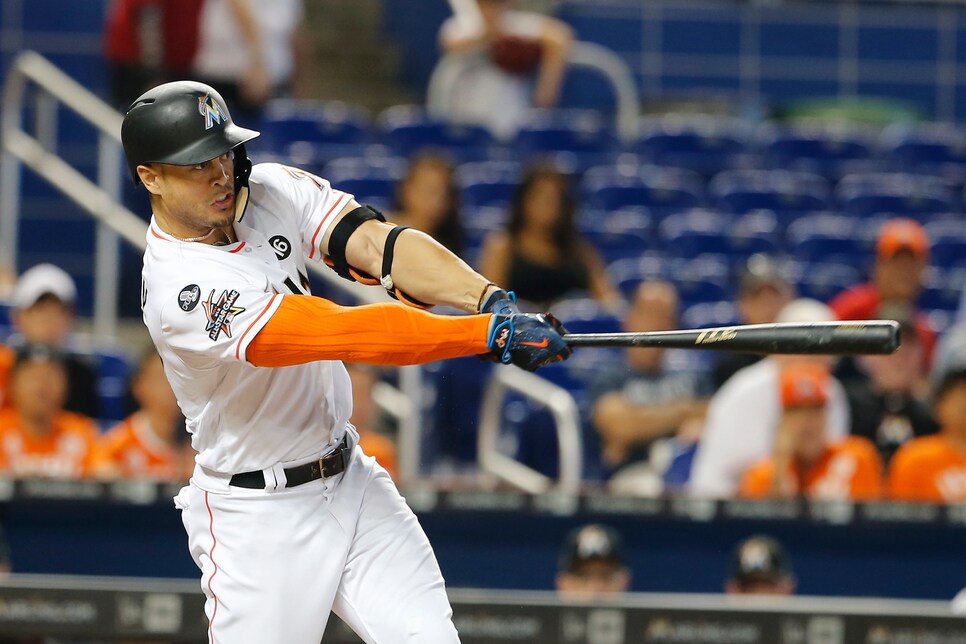 Miami Marlins right fielder Giancarlo Stanton reacts after