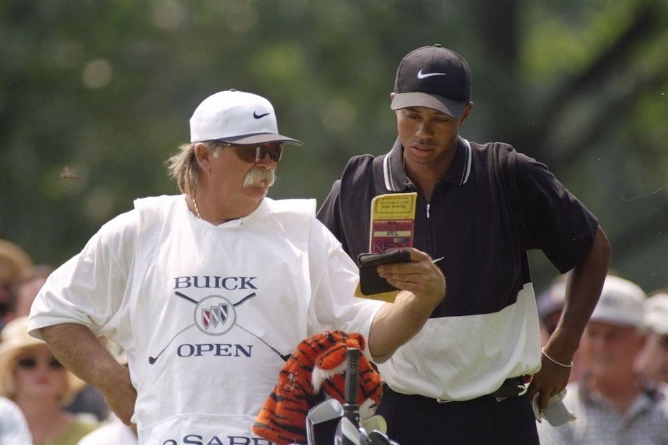 9 Aug 1997:  Mike (Fluff) Cowen speaks with Tiger Woods on the 18th hole during the Buick Open at Warwick Hills Country Club in Grand Blanc, Michigan. Mandatory Credit: Matthew Stockman  /Allsport