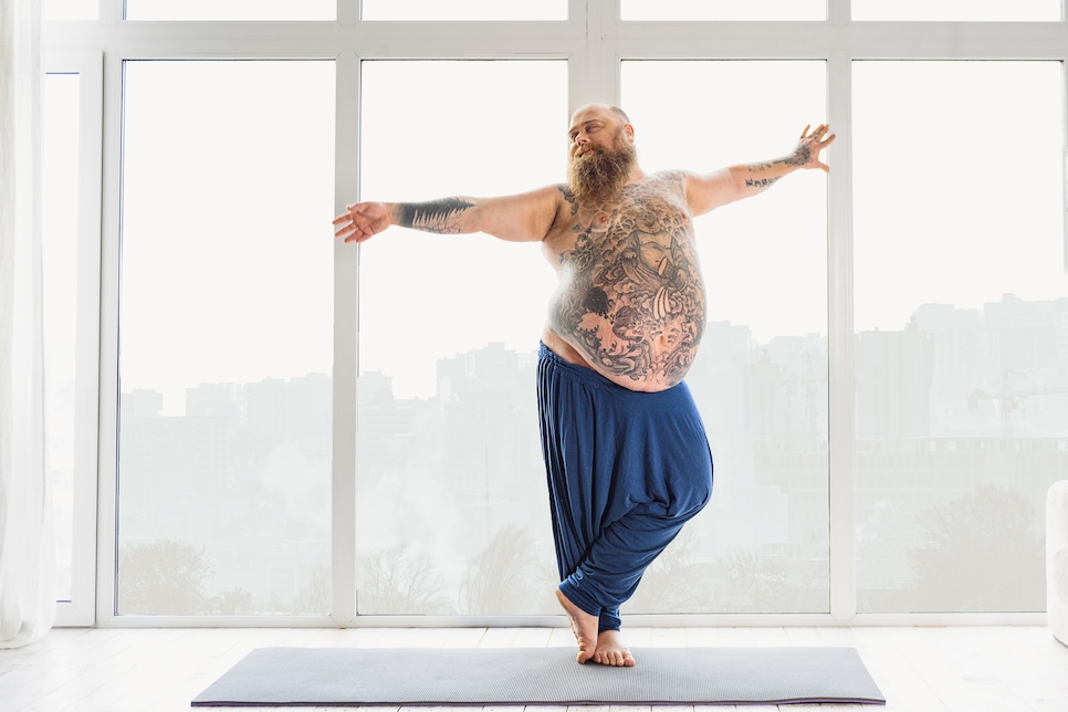 Happy male fatso enjoying morning exercise