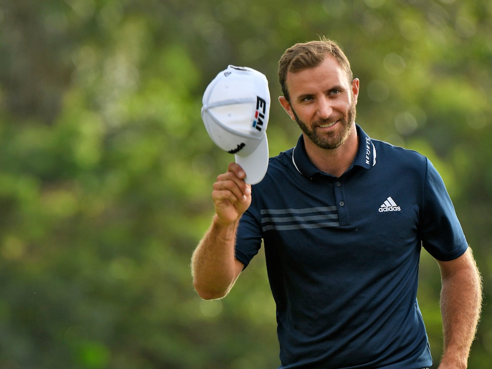 LAHAINA, HI - JANUARY 07: Dustin Johnson acknowledges the gallery on the 18th green after winning the Sentry Tournament of Champions at Plantation Course at Kapalua on January 7, 2018 in Lahaina, Hawaii. (Photo by Stan Badz/PGA TOUR)