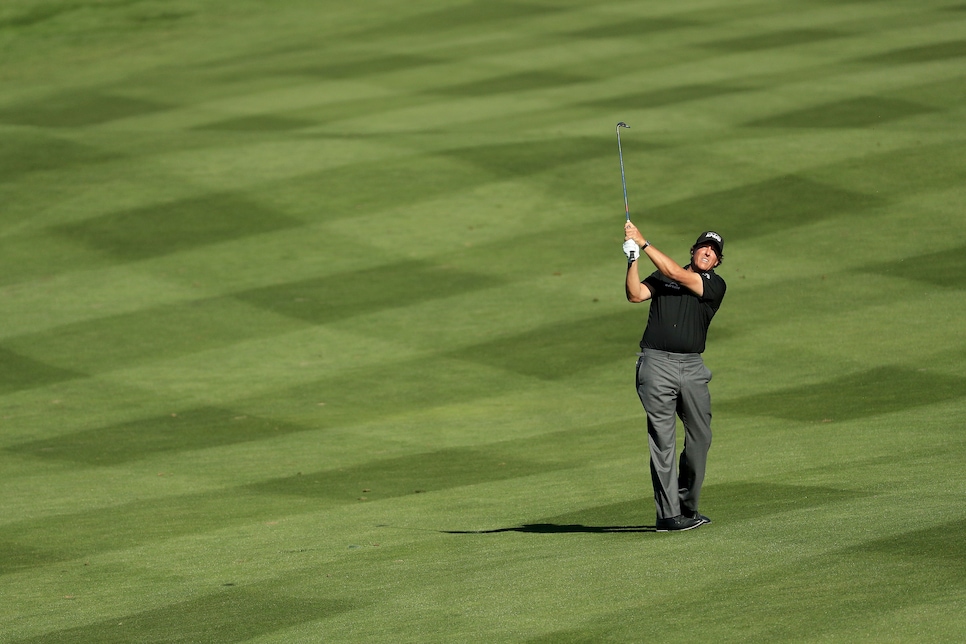 phil-mickelson-pebble-2018-sunday-hitting-iron-shot-solo-fairway.jpg