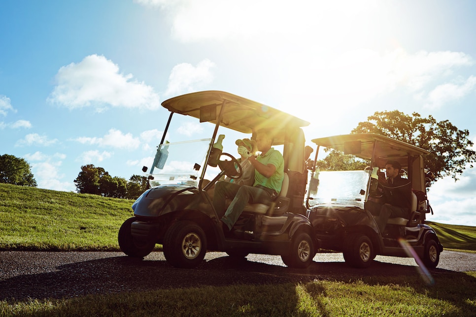 Shot of a group of friends riding in a golf cart on a golf course