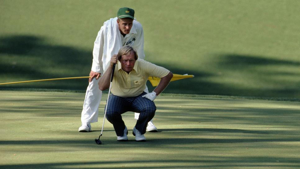 AUGUSTA, GA - April 1986:  Jack NIcklaus and caddy, son, Jackie Nicklaus, line up a putt during the 1986 Masters Tournament at Augusta National Golf Club on April 10-13, 1986 in Augusta, Georgia. (Photo by Augusta National/Getty Images)