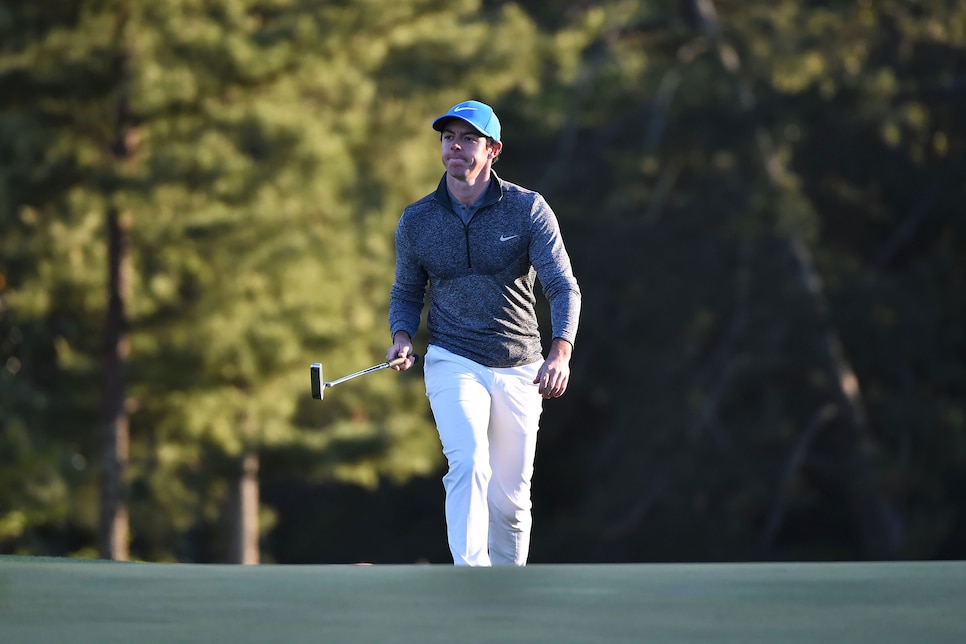 Northern Ireland\'s Rory McIlroy reacts as he walks on the 18th green during Round 3 of the 80th Masters Golf Tournament at the Augusta National Golf Club on April 9, 2016, in Augusta, Georgia. / AFP / Nicholas Kamm        (Photo credit should read NICHOLAS KAMM/AFP/Getty Images)