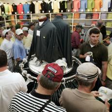 Augusta, UNITED STATES: Patrons look over merchandise at the gift shop at the Augusta National Golf Club 02 April 2007 during the first practice round for the 71st Masters Golf Tournament in Augusta, Georgia. The tournament will start 05 April.      AFP PHOTO/Jeff HAYNES (Photo credit should read JEFF HAYNES/AFP/Getty Images)