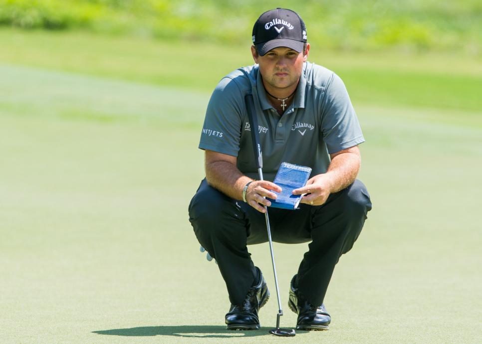 August 14 2014: Patrick Reed lines up his put on the 8th hole during the first round of the Wyndham Championship at Sedgefield Country Club in Greensboro, NC.