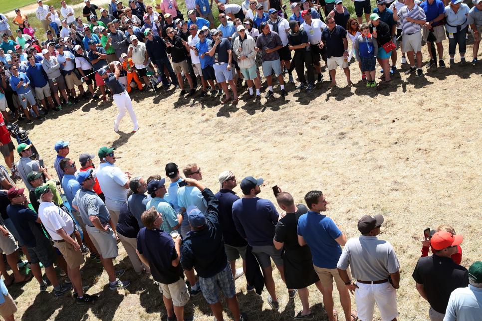 SOUTHAMPTON, NY - JUNE 15:  Paul Casey of England plays his second shot on the third hole as a gallery of patrons look on during the second round of the 2018 U.S. Open at Shinnecock Hills Golf Club on June 15, 2018 in Southampton, New York.  (Photo by Andrew Redington/Getty Images)