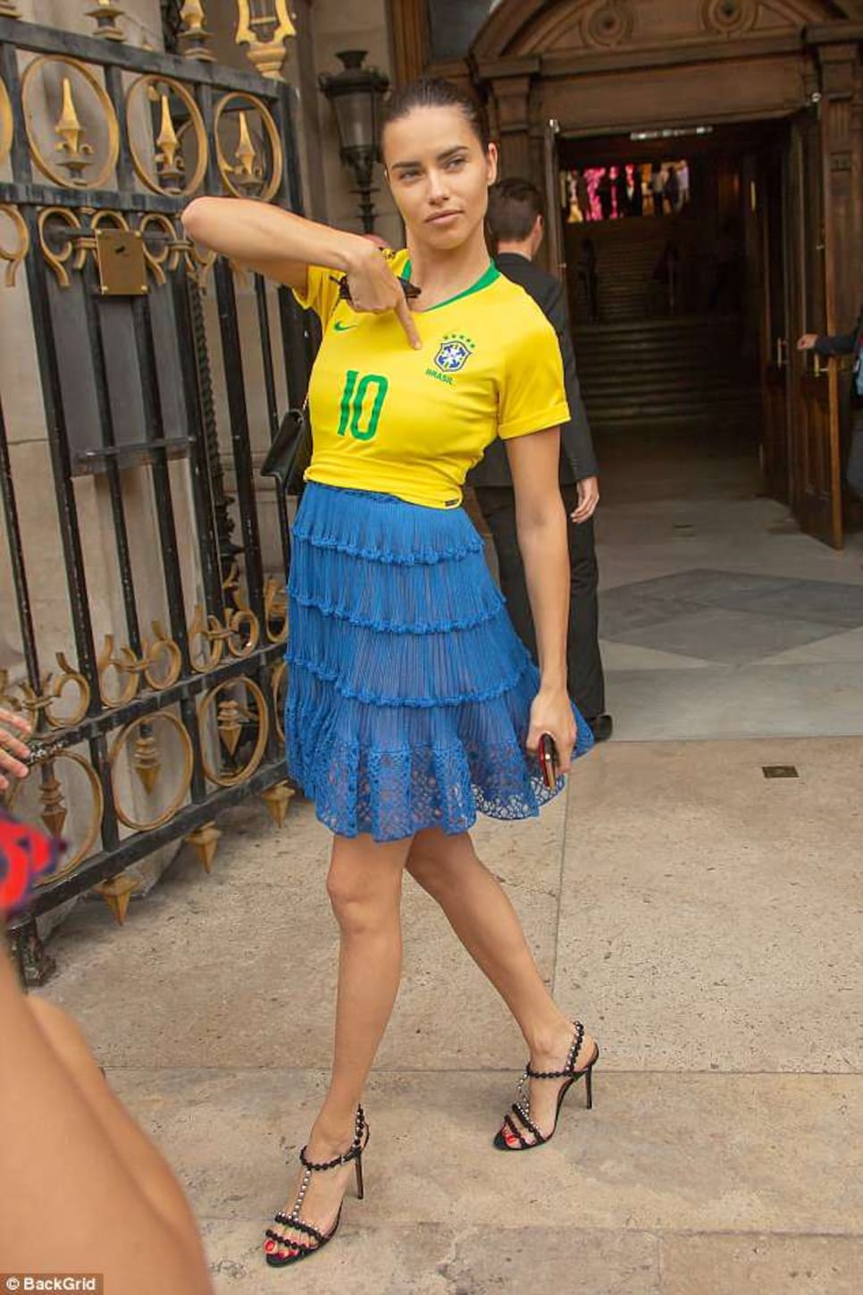 Adriana Lima Wears a Brazil Soccer Jersey At Couture Fashion Week