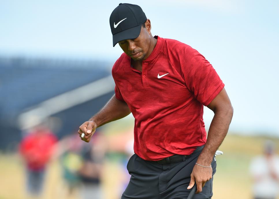 US golfer Tiger Woods reacts after holing his birdie putt on the 14th green during his final round on day 4 of The 147th Open golf Championship at Carnoustie, Scotland on July 22, 2018. (Photo by ANDY BUCHANAN / AFP)        (Photo credit should read ANDY BUCHANAN/AFP/Getty Images)
