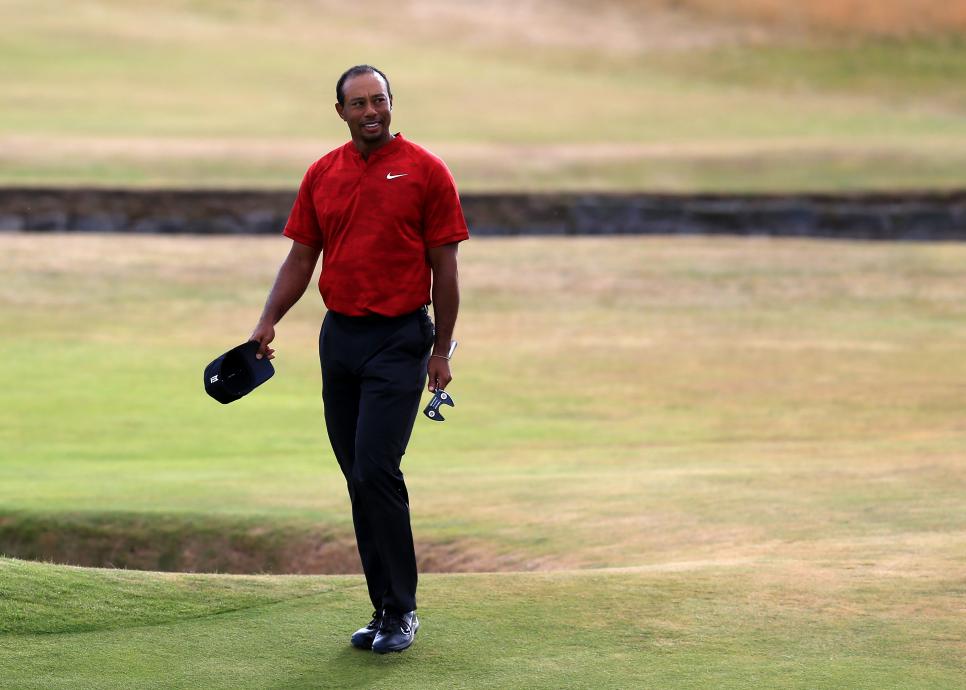 22nd July 2018, Carnoustie Golf Links, Angus, Scotland; The 147th Open Golf Championship, 4th round; Tiger Woods (USA) smiles as he walks onto the 18th green at -5 for the tournament (photo by David Blunsden/Action Plus via Getty Images)
