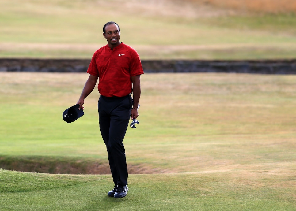 22nd July 2018, Carnoustie Golf Links, Angus, Scotland; The 147th Open Golf Championship, 4th round; Tiger Woods (USA) smiles as he walks onto the 18th green at -5 for the tournament (photo by David Blunsden/Action Plus via Getty Images)