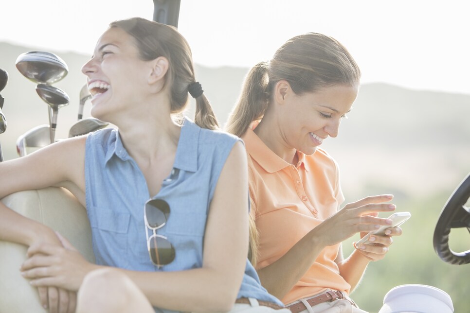 Women sitting in golf cart
