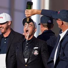 TOPSHOT - USA\'s Vice-Captain Tom Lehman (R) pours champagne on Rickie Fowler\'s (C) head  and Jimmy Walker (L) laughs as they celebrate winning the 41st Ryder Cup at Hazeltine National Golf Course in Chaska, Minnesota, October 2, 2016.  / AFP / JIM WATSON        (Photo credit should read JIM WATSON/AFP/Getty Images)