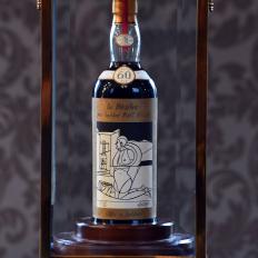 The bottle of Macallan Valerio Adamai 1926 whisky which sold for a world record sale price of £700,000 is on show during its auction in Edinburgh on October 3, 2018. - The whisky, which was in a vat for 60 years from 1926 then bottled, fetched £700,000 plus a £148,000 sales premium to make it the most expensive whisky for £848,000. (Photo by Andy Buchanan / AFP)        (Photo credit should read ANDY BUCHANAN/AFP/Getty Images)