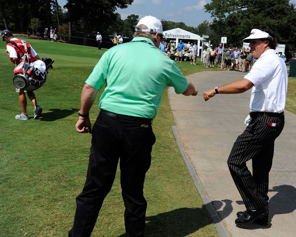 johnny-miller-phil-mickelson-fist-bump-2012-tour-championship.jpg