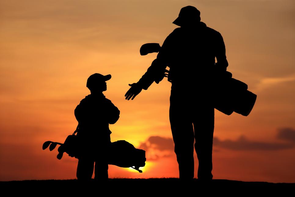 Silhouette of Father and Son on the Golf Course