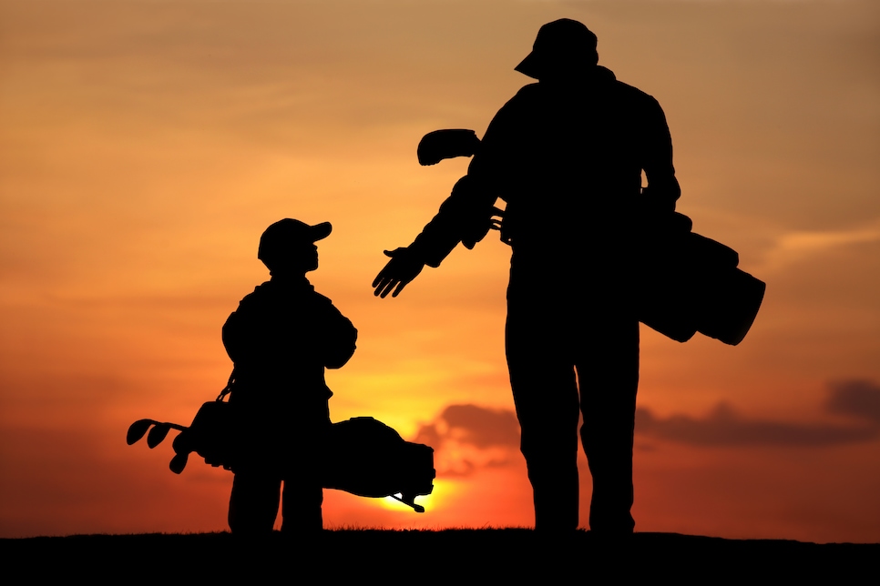 Silhouette of Father and Son on the Golf Course