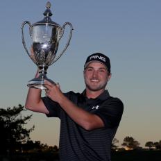 ST SIMONS ISLAND, GEORGIA - NOVEMBER 19:  Austin Cook of United States celebrates with the trophy on the 18th green after winning the final round of The RSM Classic at Sea Island Golf Club Seaside Course on November 19, 2017 in St Simons Island, Georgia. (Photo by Streeter Lecka/Getty Images)