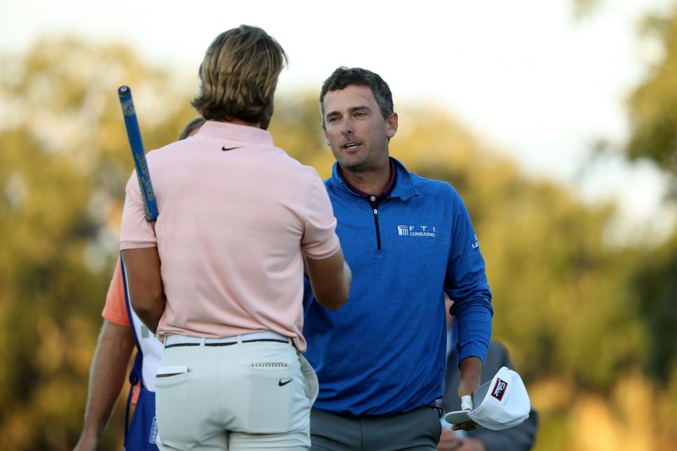 ST SIMONS ISLAND, GEORGIA - NOVEMBER 18: Charles Howell III of the United States shakes hands with Patrick Rodgers of the United States after making his putt on the 18th hole in the second playoff of the final round to win the RSM Classic at the Sea Island Golf Club Seaside Course on November 18, 2018 in St. Simons Island, Georgia. (Photo by Streeter Lecka/Getty Images)
