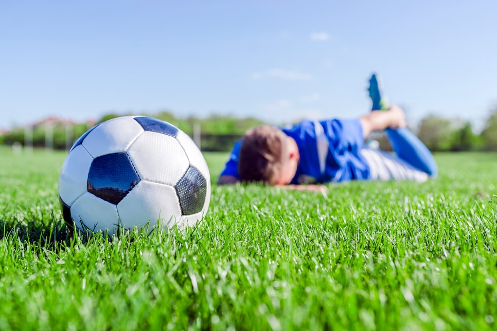 Injured football player on stadium field