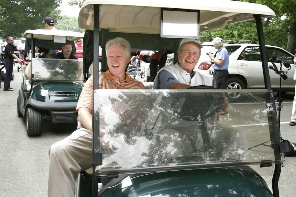 Staff photo by Gregory Rec -- Tuesday, June 28, 2005 -- Former presidents Bill Clinton and George H.W. Bush drive to the first tee at the Cape Arundel Golf Course in Kennebunkport on Tuesday. Clinton was visiting the Bush family while in town for a book signing.  (Photo by Gregory Rec/Portland Press Herald via Getty Images)