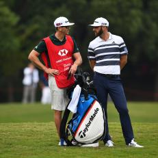 Dustin Johnson of the US (R) speaks to his caddy during the first round of the WGC-HSBC Champions golf tournament in Shanghai on October 25, 2018. (Photo by JOHANNES EISELE / AFP)        (Photo credit should read JOHANNES EISELE/AFP/Getty Images)