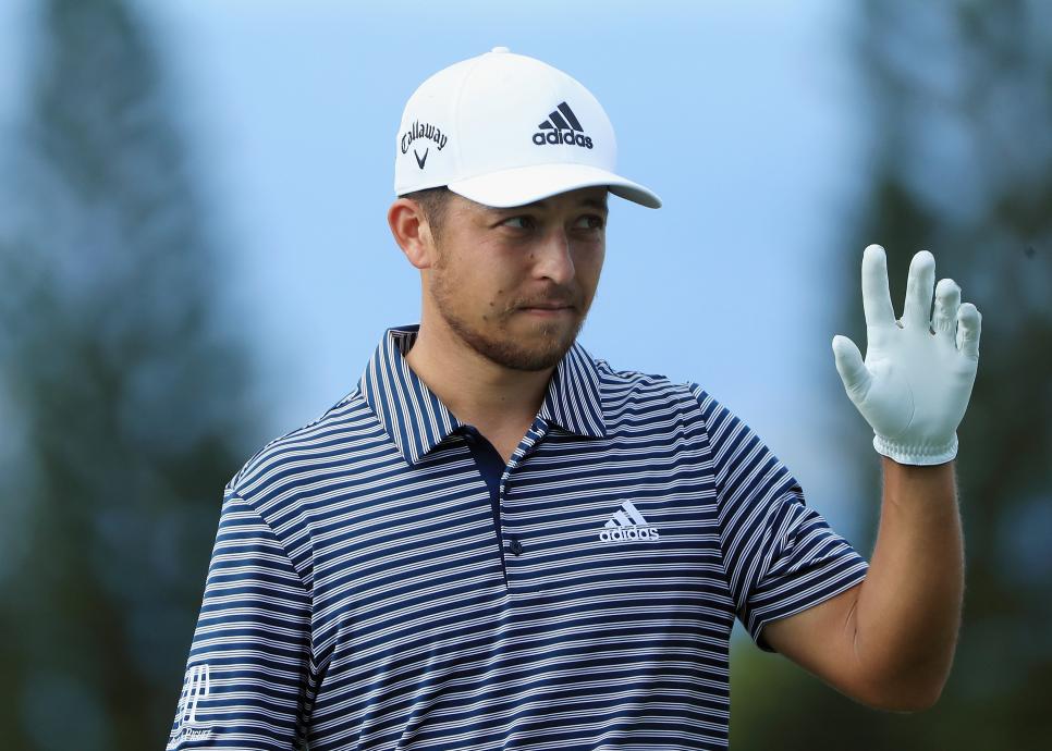 LAHAINA, HI - JANUARY 06:  Xander Schauffele of the United States acknowledges the crowd after chipping in for eagle on the ninth hole during the final round of the Sentry Tournament of Champions at the Plantation Course at Kapalua Golf Club on January 6, 2019 in Lahaina, Hawaii.  (Photo by Sam Greenwood/Getty Images)
