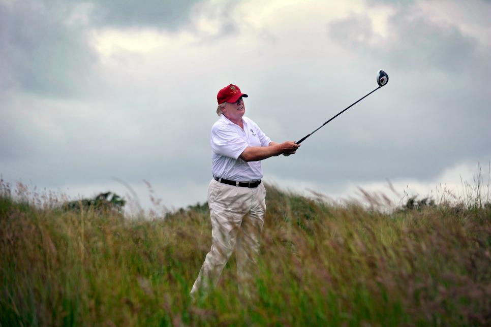 US tycoon Donald Trump plays a stroke as