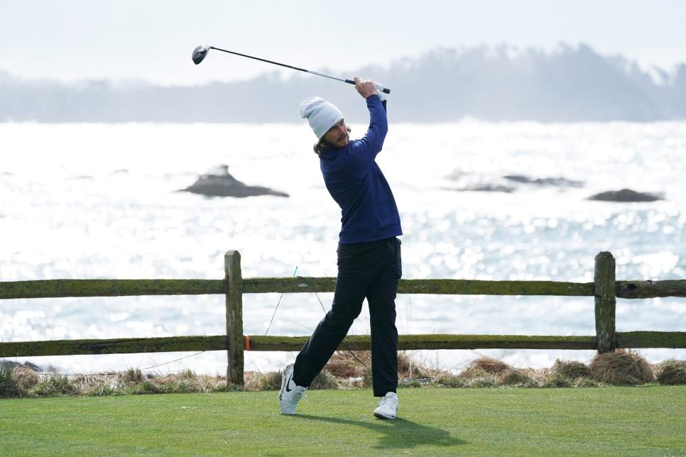 PEBBLE BEACH, CALIFORNIA - FEBRUARY 05: Tommy Fleetwood of England plays a shot during a practice round prior to the AT