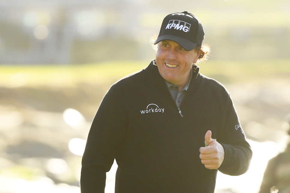 PEBBLE BEACH, CALIFORNIA - FEBRUARY 11:  Phil Mickelson of the United States walks up the 18th hole during the continuation of the final round of the AT