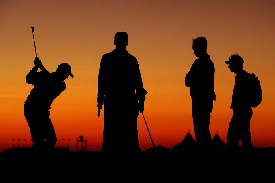 KIAWAH ISLAND, SC - NOVEMBER 15:  Nicklas Fasth of Sweden practices on the range as friends and coaches look on following the third round of the World Golf Championships World Cup on November 15, 2003 at the Kiawah Island Golf Resort Ocean Course on Kiawah Island, South Carolina.  (Photo by Jamie Squire/Getty Images)