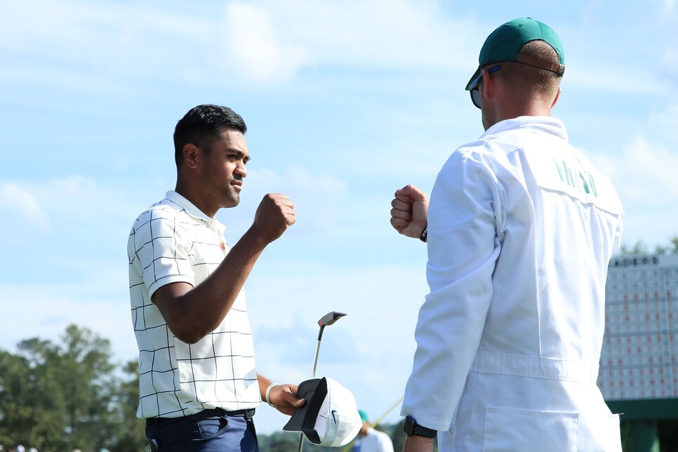 tony-finau-masters-2019-saturday-caddie-fist-bump.jpg