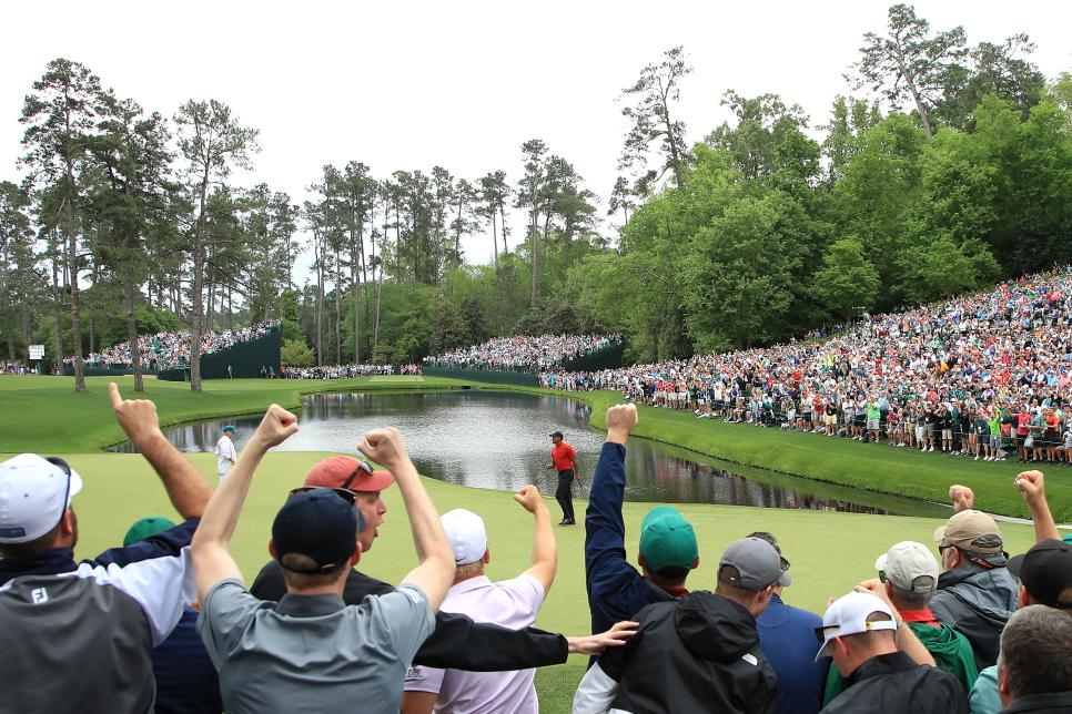 AUGUSTA, GEORGIA - APRIL 14: Patrons cheer as Tiger Woods of the United States celebrates his birdie on the 16th green during the final round of the Masters at Augusta National Golf Club on April 14, 2019 in Augusta, Georgia. (Photo by Andrew Redington/Getty Images)