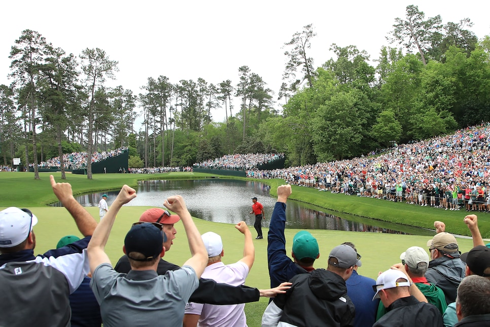 AUGUSTA, GEORGIA - APRIL 14: Patrons cheer as Tiger Woods of the United States celebrates his birdie on the 16th green during the final round of the Masters at Augusta National Golf Club on April 14, 2019 in Augusta, Georgia. (Photo by Andrew Redington/Getty Images)