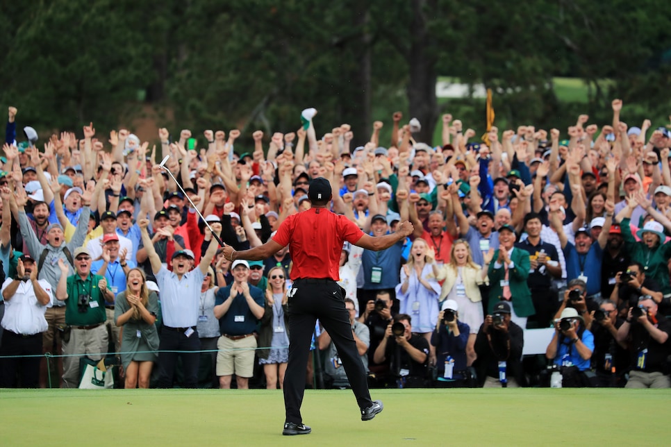 AUGUSTA, GEORGIA - APRIL 14: Tiger Woods of the United States celebrates after sinking his putt on the 18th green to win during the final round of the Masters at Augusta National Golf Club on April 14, 2019 in Augusta, Georgia. (Photo by David Cannon/Getty Images)