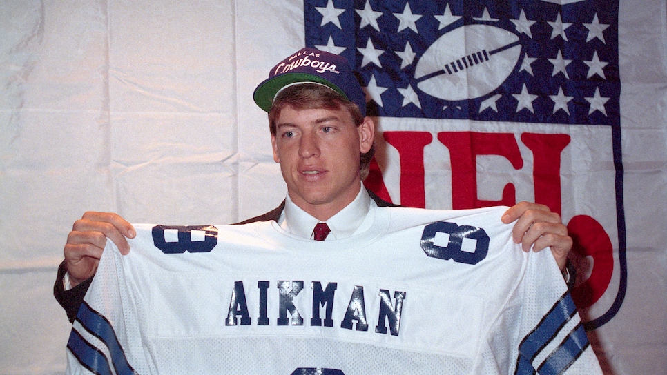 Troy Aikman Holding Jersey