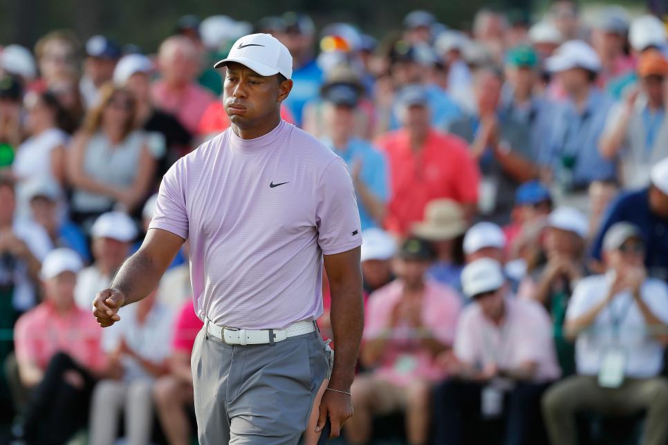 AUGUSTA, GEORGIA - APRIL 13: Tiger Woods of the United States reacts on the 18th green during the third round of the Masters at Augusta National Golf Club on April 13, 2019 in Augusta, Georgia. (Photo by Kevin C. Cox/Getty Images)