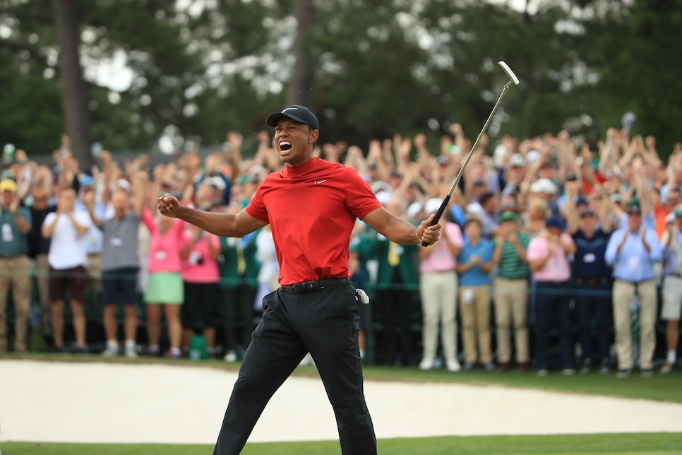 AUGUSTA, GEORGIA - APRIL 14: Tiger Woods (L) of the United States celebrates on the 18th green after winning the Masters at Augusta National Golf Club on April 14, 2019 in Augusta, Georgia. (Photo by Andrew Redington/Getty Images)