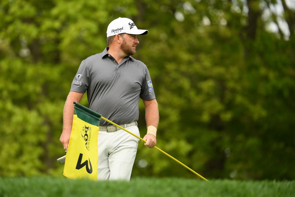 FARMINGDALE, NEW YORK - MAY 16: Graeme McDowell of Northern Ireland holds the flag on the third green during the first round of the 2019 PGA Championship at the Bethpage Black course on May 16, 2019 in Farmingdale, New York. (Photo by Ross Kinnaird/Getty Images)