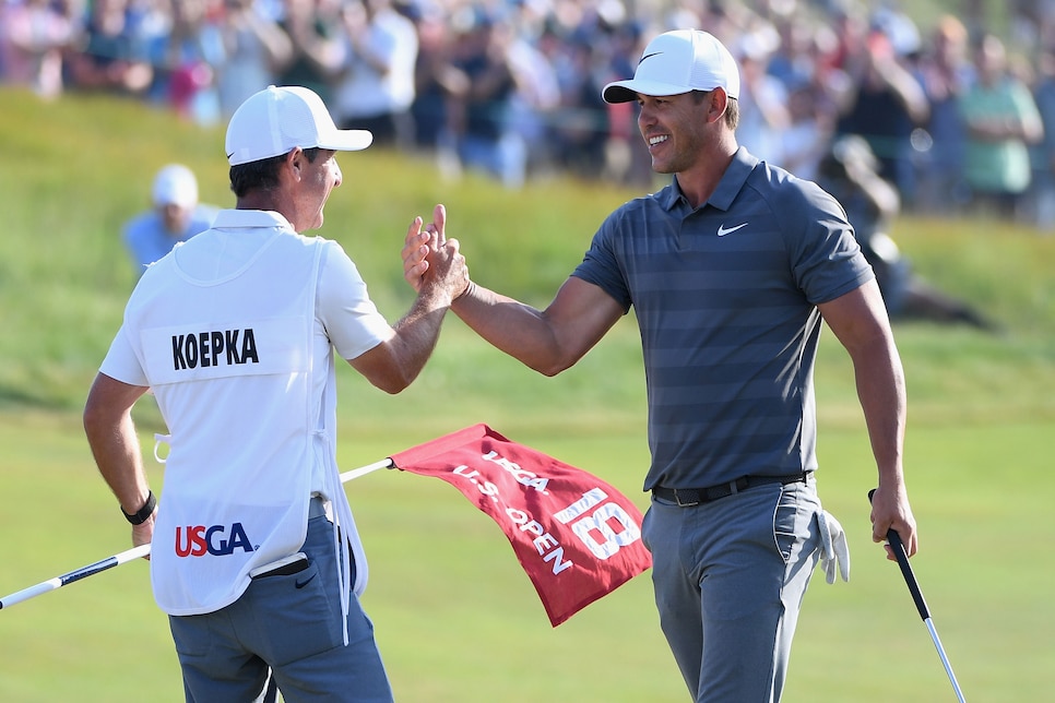 brooks-koepka-2018-us-open-victory-high-five-caddie.jpg