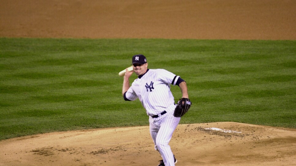 Yankee pitcher Roger Clemens throws a piece of broken bat ba