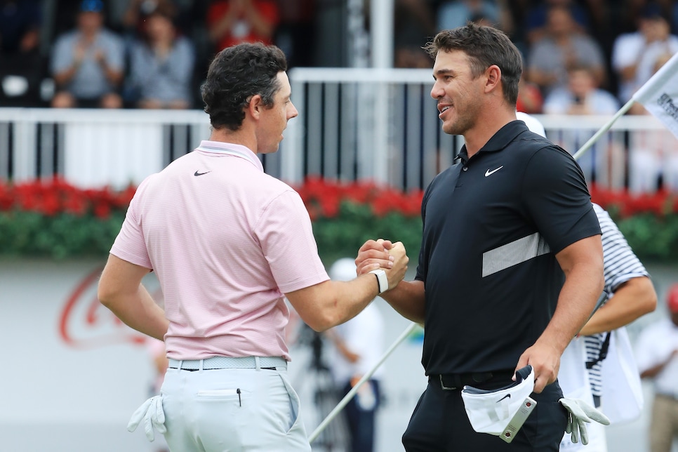 ATLANTA, GEORGIA - AUGUST 25: Brooks Koepka of the United States congratulates Rory McIlroy of Northern Ireland on the 18th green after McIlroy won the FedEx Cup and Tour Championship during the final round of the TOUR Championship at East Lake Golf Club on August 25, 2019 in Atlanta, Georgia. (Photo by Streeter Lecka/Getty Images)