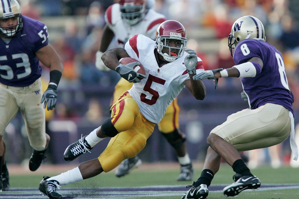 USC running back Reggie Bush cuts into the UW defense for a rushing gain in the second half as the