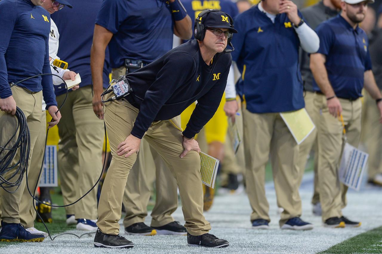 Jim Harbaugh takes on Comerica Park, khakis and all