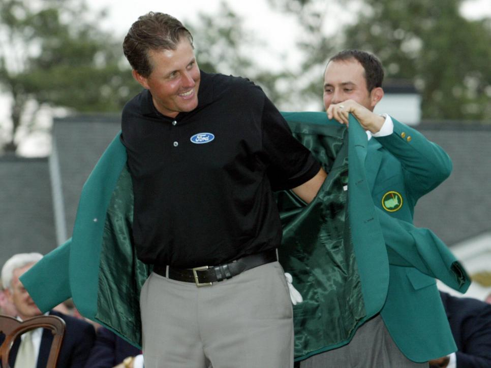 Phil Mickelson (L) of the US receives th