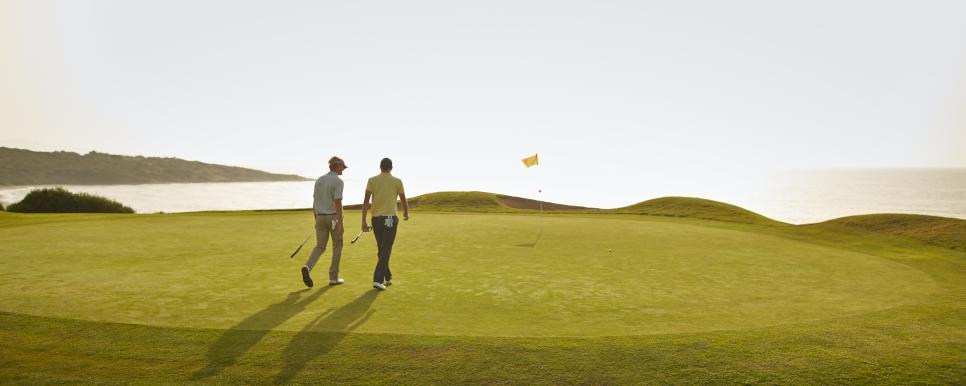 Men walking on golf course